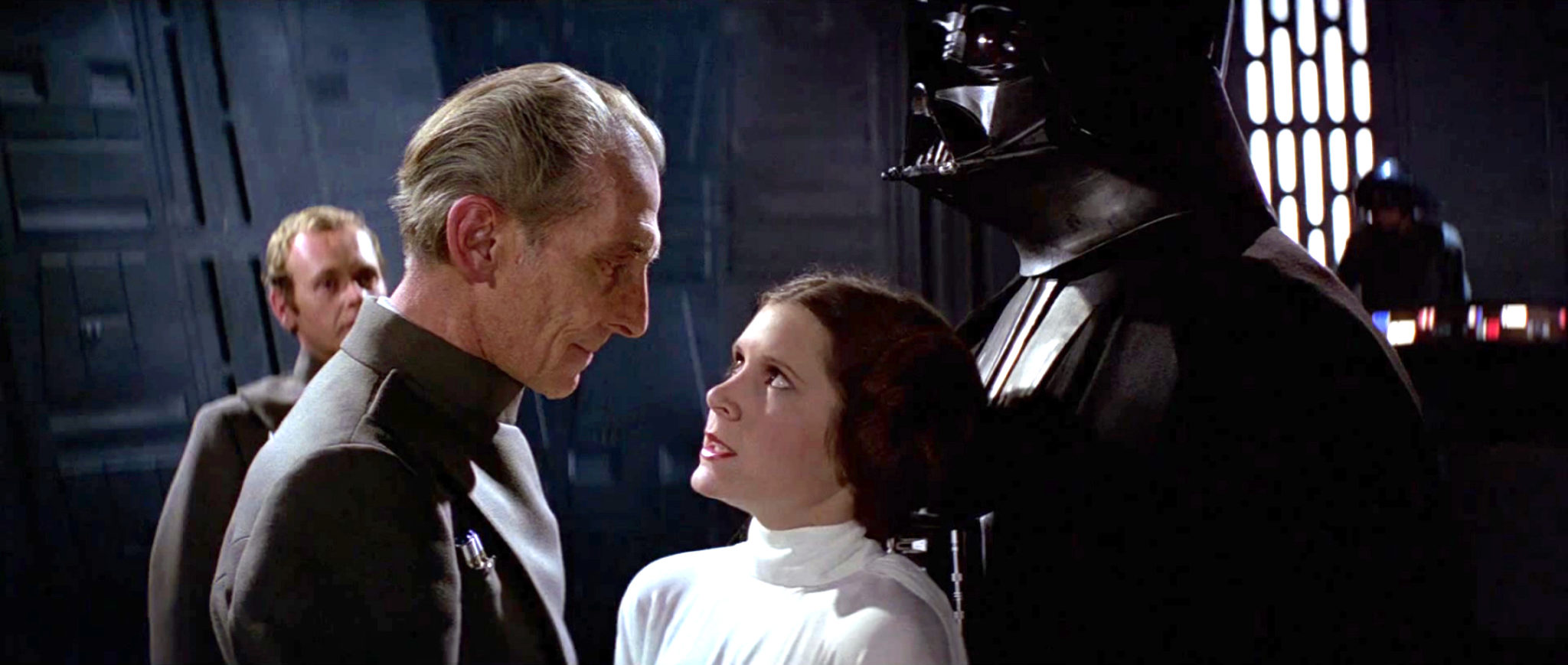 Charming to the last: Peter Cushing as Grand Moff Tarkin intimidates Carrie...